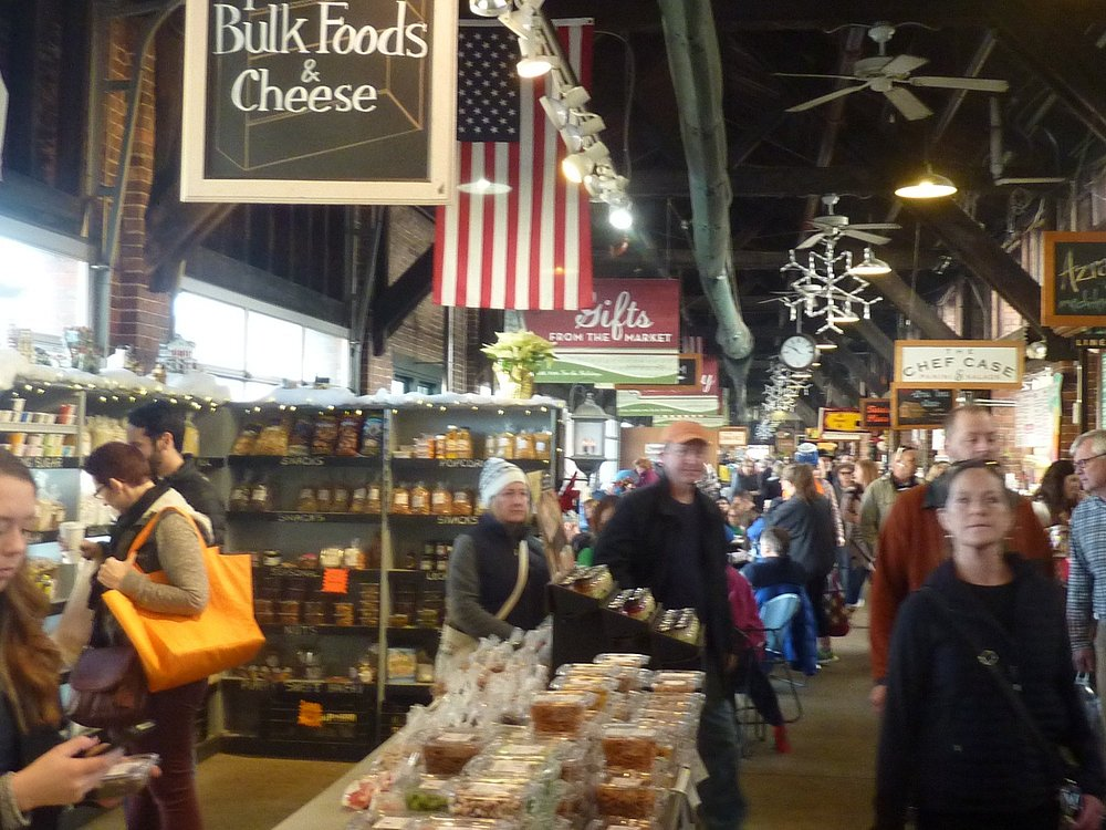 market with American flag and people walking around
